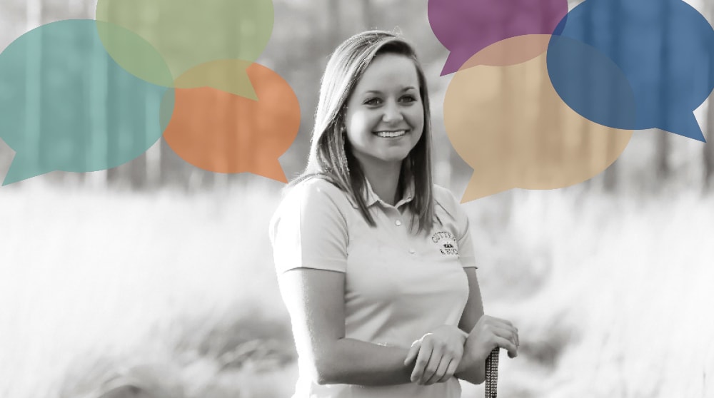 A young woman with a golf polo stands in a wooded grassy area and smiles at the camera. Digital speech bubble graphics are placed on the image around her head.